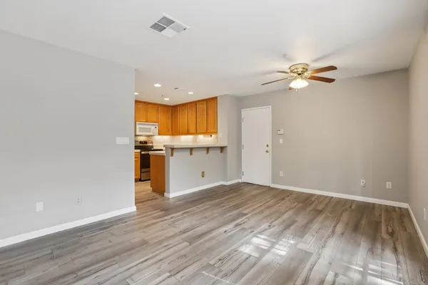 a kitchen with wooden cabinets and a stove top oven