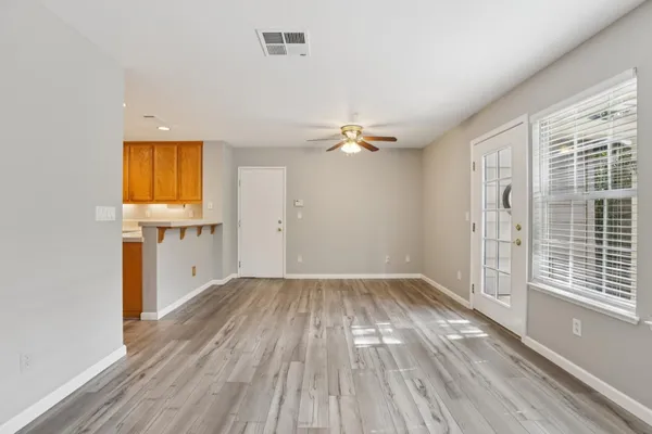 a view of kitchen with cabinets and wooden floor