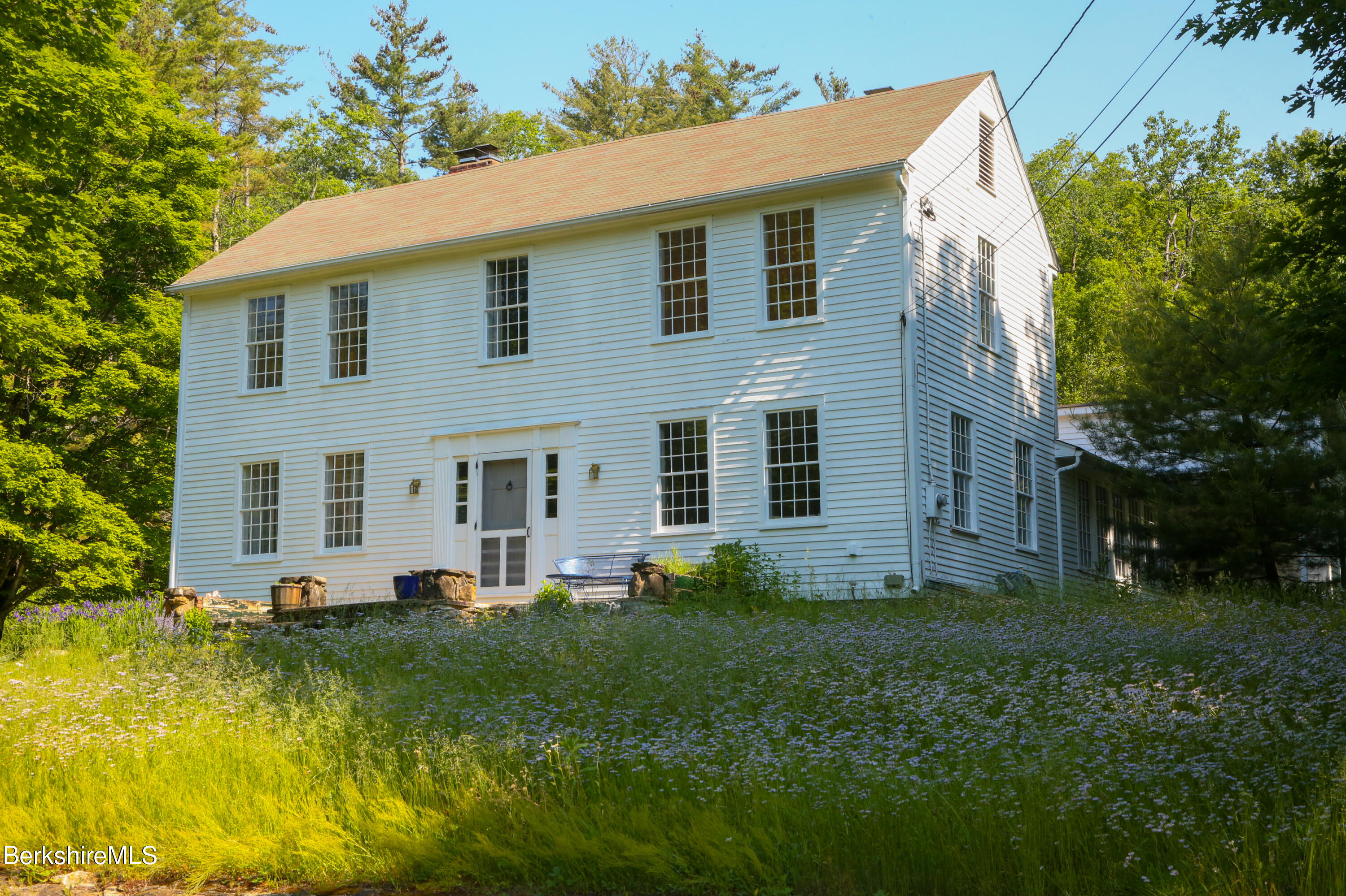 228 Zoar Road Rowe, MA 01367 - Photo 1 of 50 a front view of house with yard and green space