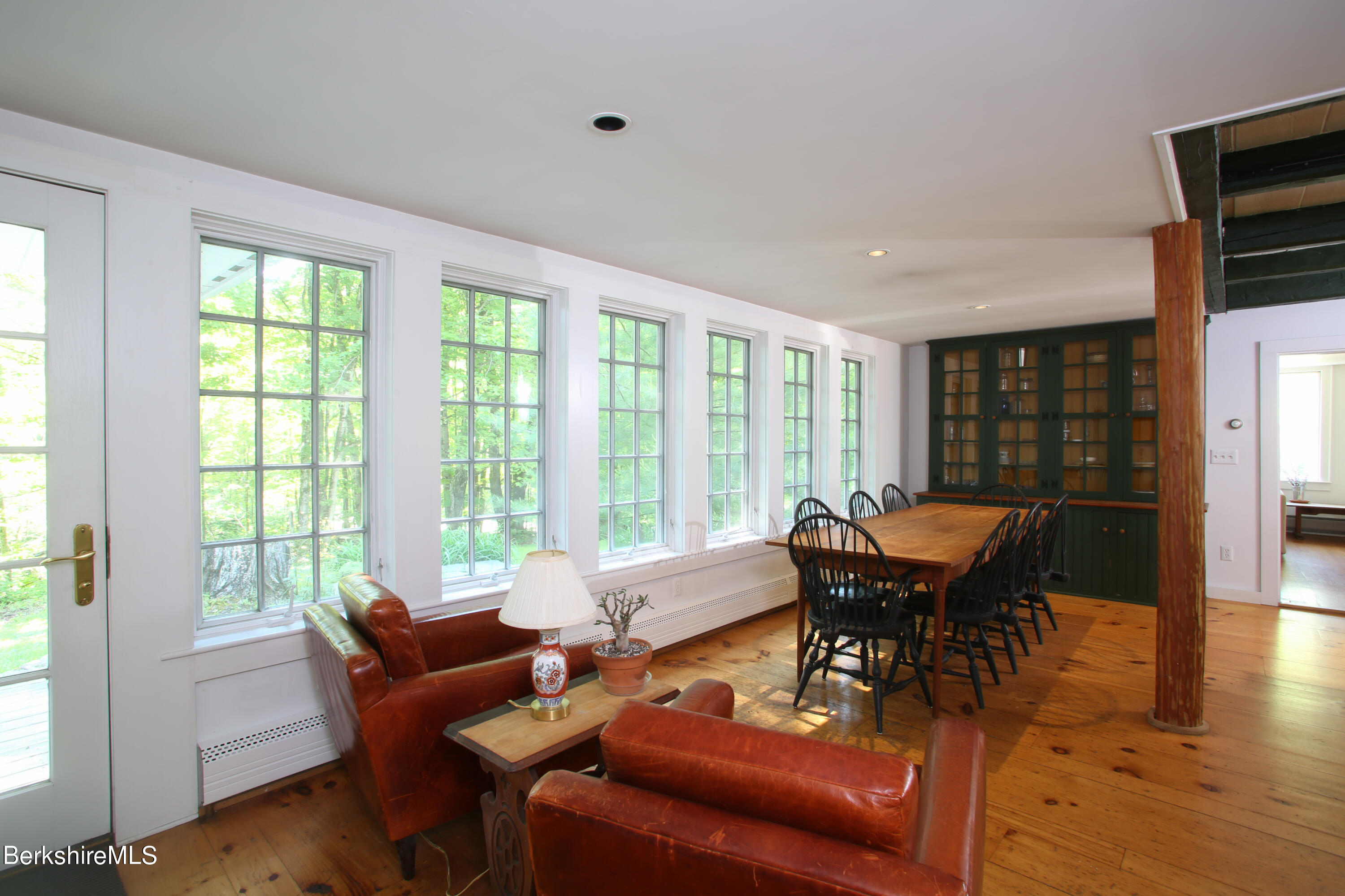228 Zoar Road Rowe, MA 01367 - Photo 11 of 50 a living room with furniture and a floor to ceiling window
