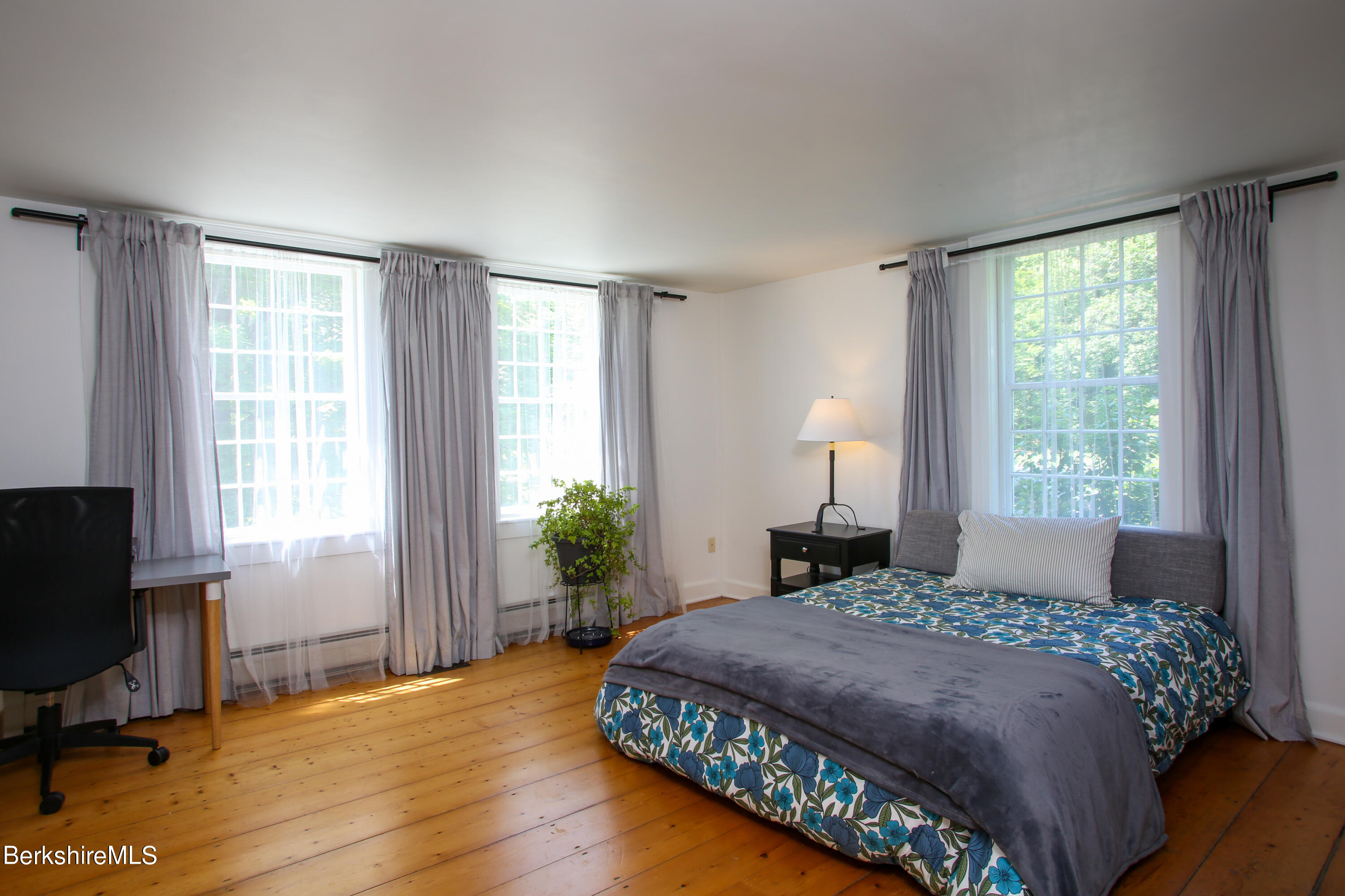 228 Zoar Road Rowe, MA 01367 - Photo 16 of 50 a bedroom with a bed table chair and a window