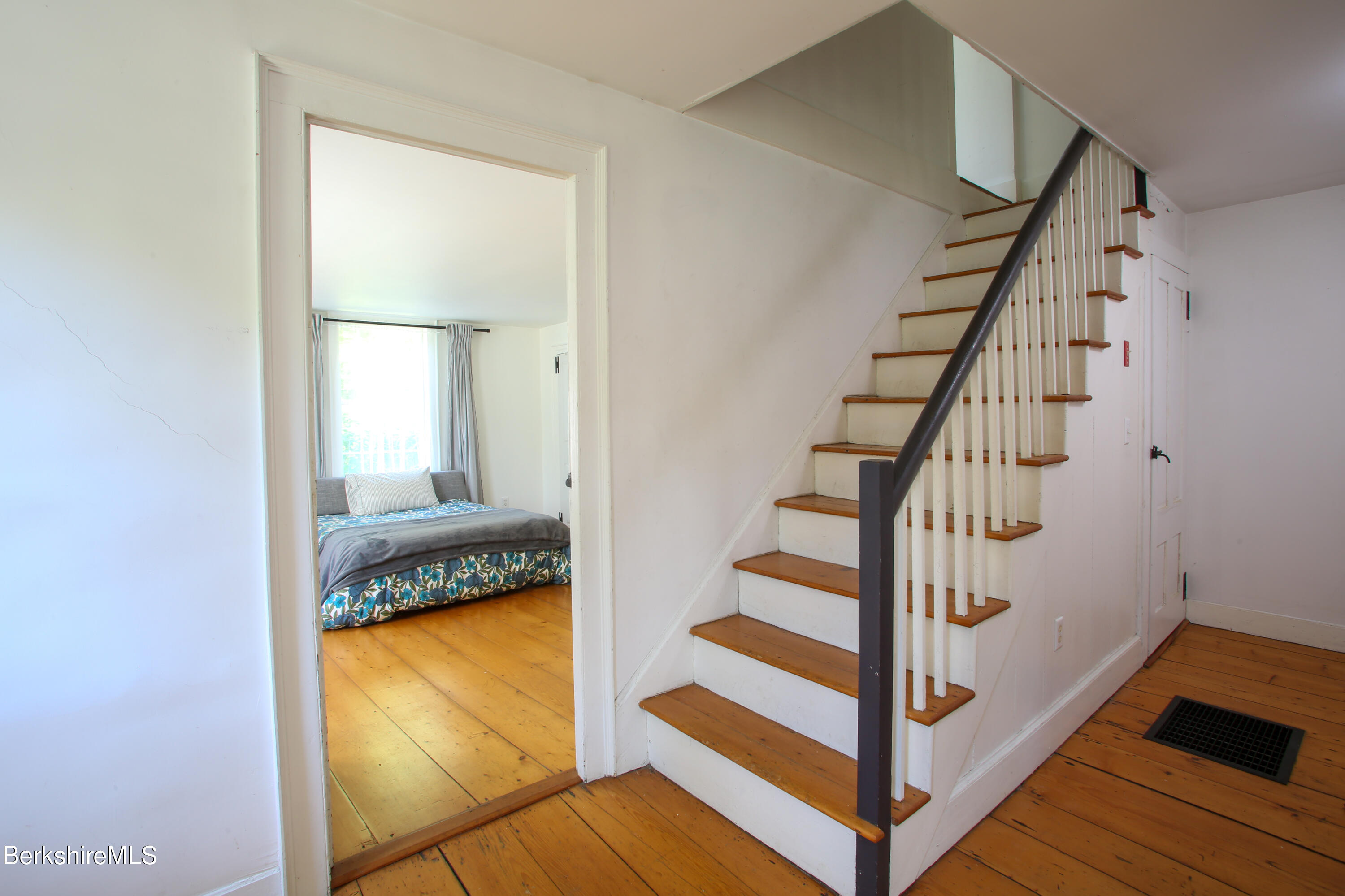 228 Zoar Road Rowe, MA 01367 - Photo 17 of 50 a view of entryway and hall with wooden floor