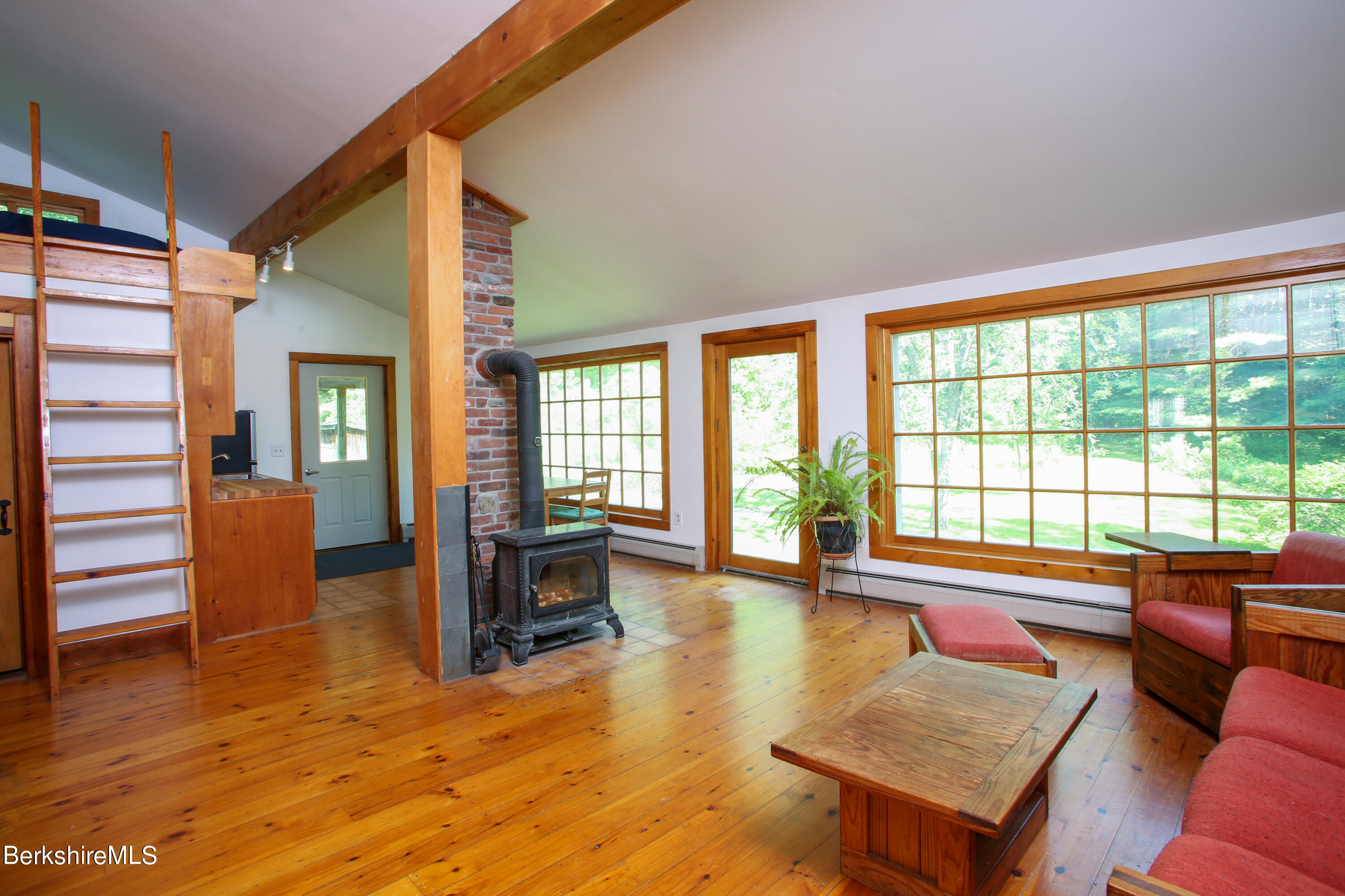 228 Zoar Road Rowe, MA 01367 - Photo 20 of 50 a living room with furniture and a large window