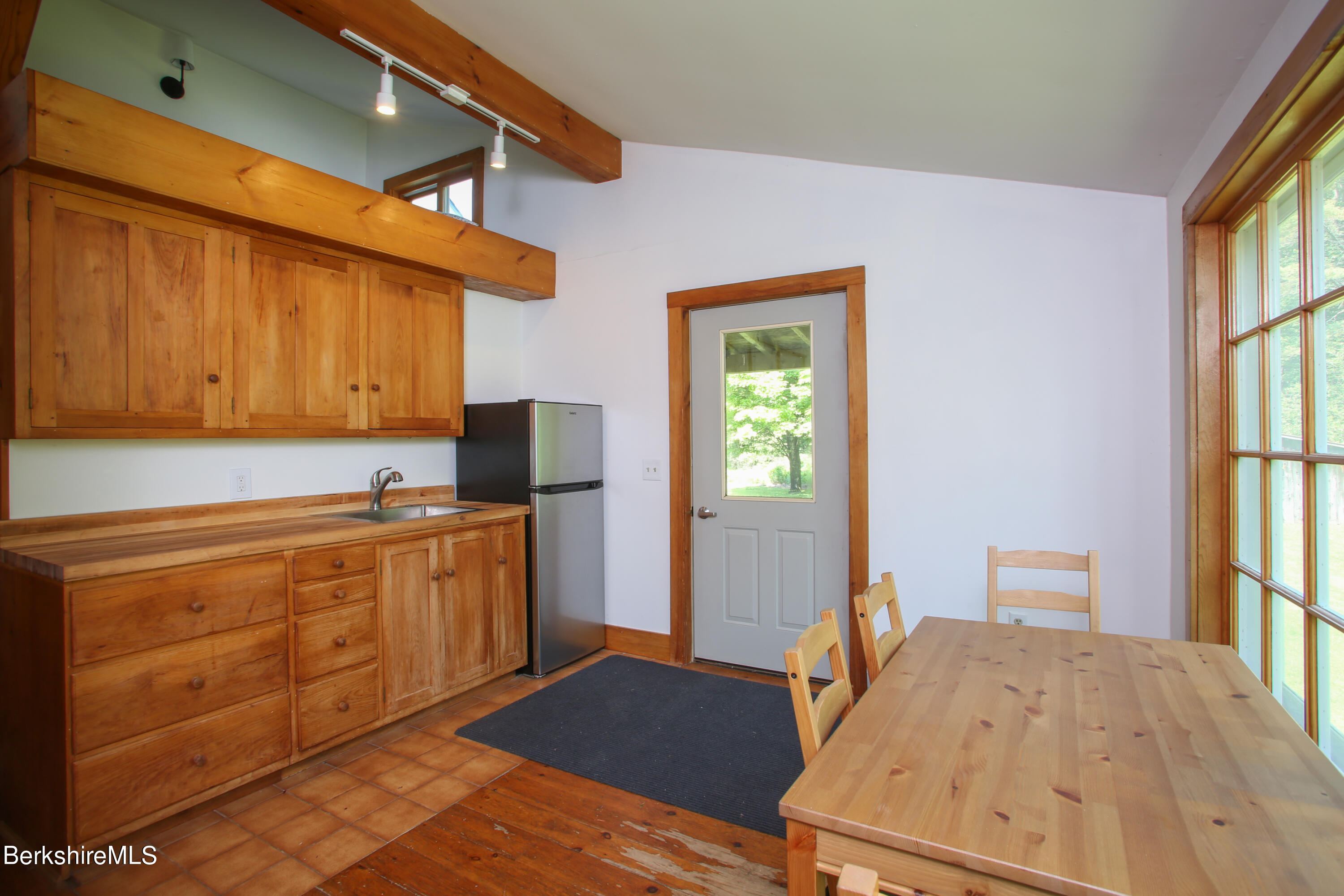 228 Zoar Road Rowe, MA 01367 - Photo 22 of 50 a kitchen with stainless steel appliances granite countertop a stove a sink and a microwave