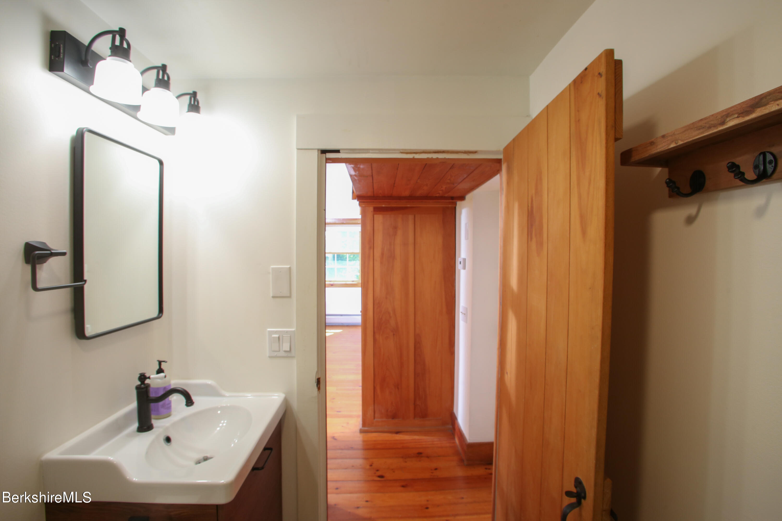 228 Zoar Road Rowe, MA 01367 - Photo 27 of 50 a bathroom with a sink and a mirror
