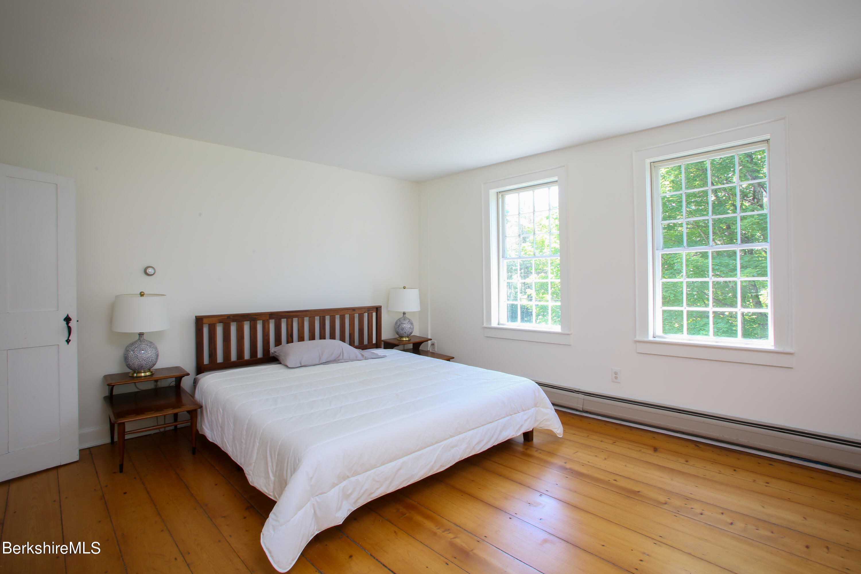 228 Zoar Road Rowe, MA 01367 - Photo 31 of 50 a large bed sitting in a bedroom next to a window