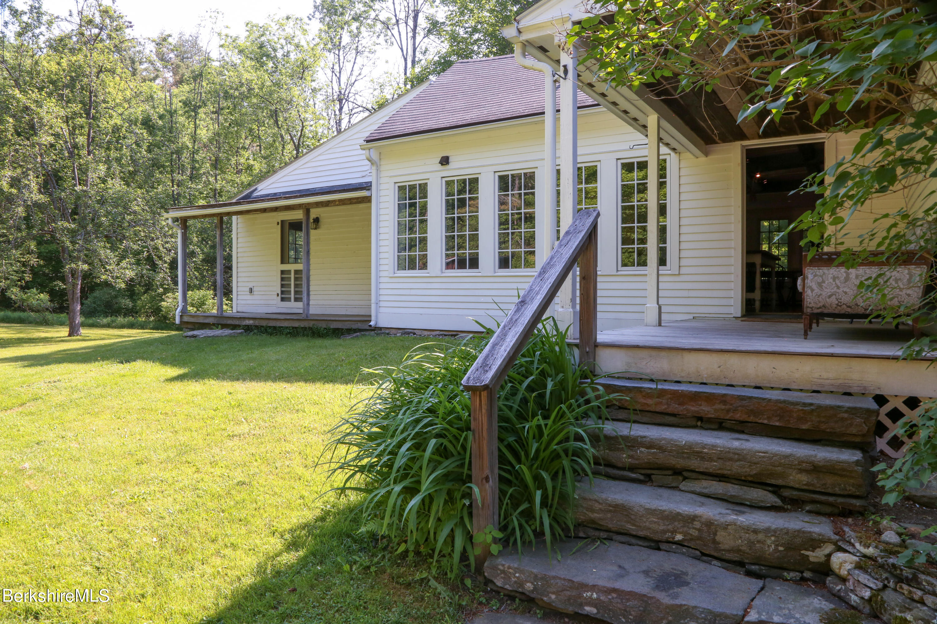 228 Zoar Road Rowe, MA 01367 - Photo 36 of 50 a view of a house with pool and chairs