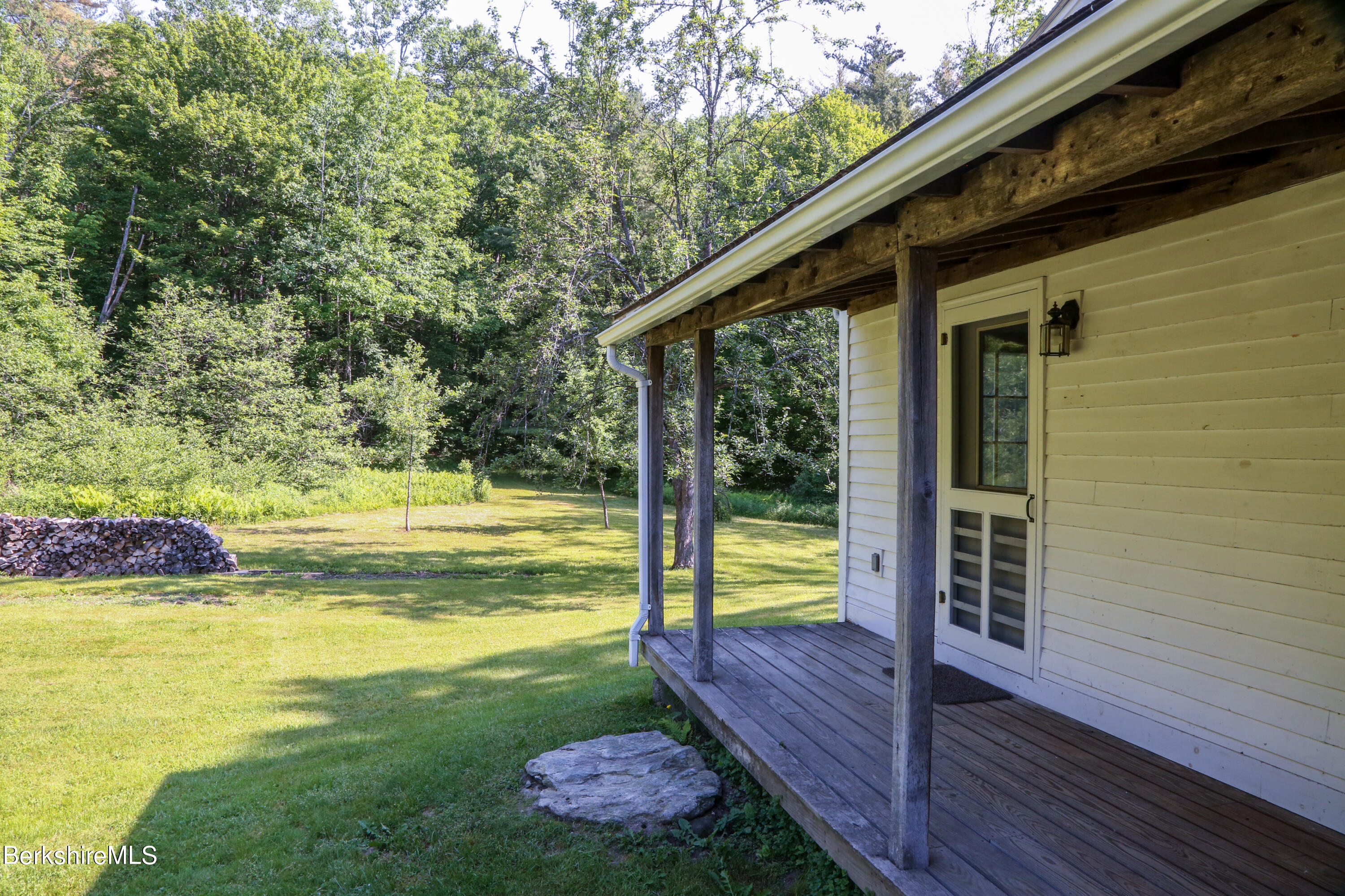 228 Zoar Road Rowe, MA 01367 - Photo 39 of 50 a view of a swimming pool with a patio