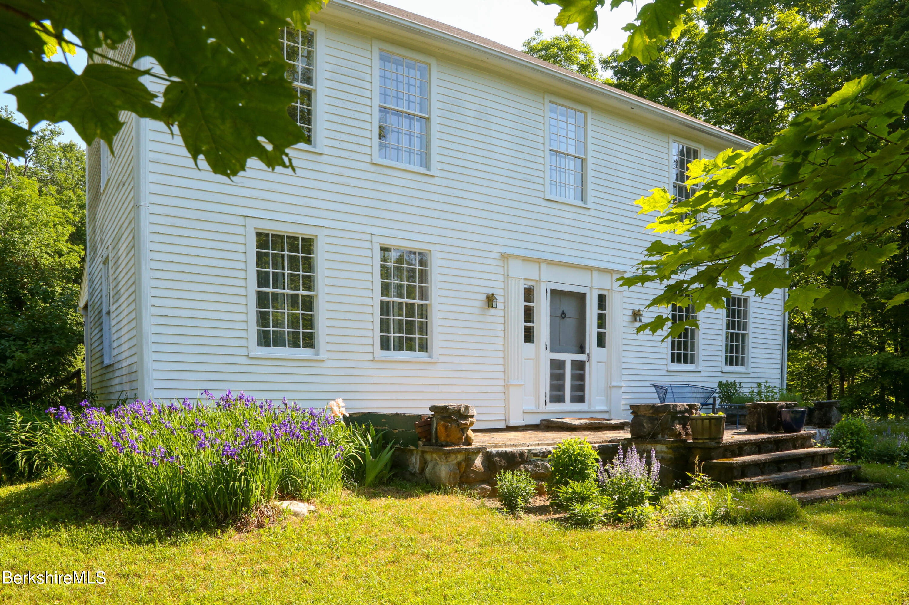 228 Zoar Road Rowe, MA 01367 - Photo 50 of 50 a front view of a house with garden