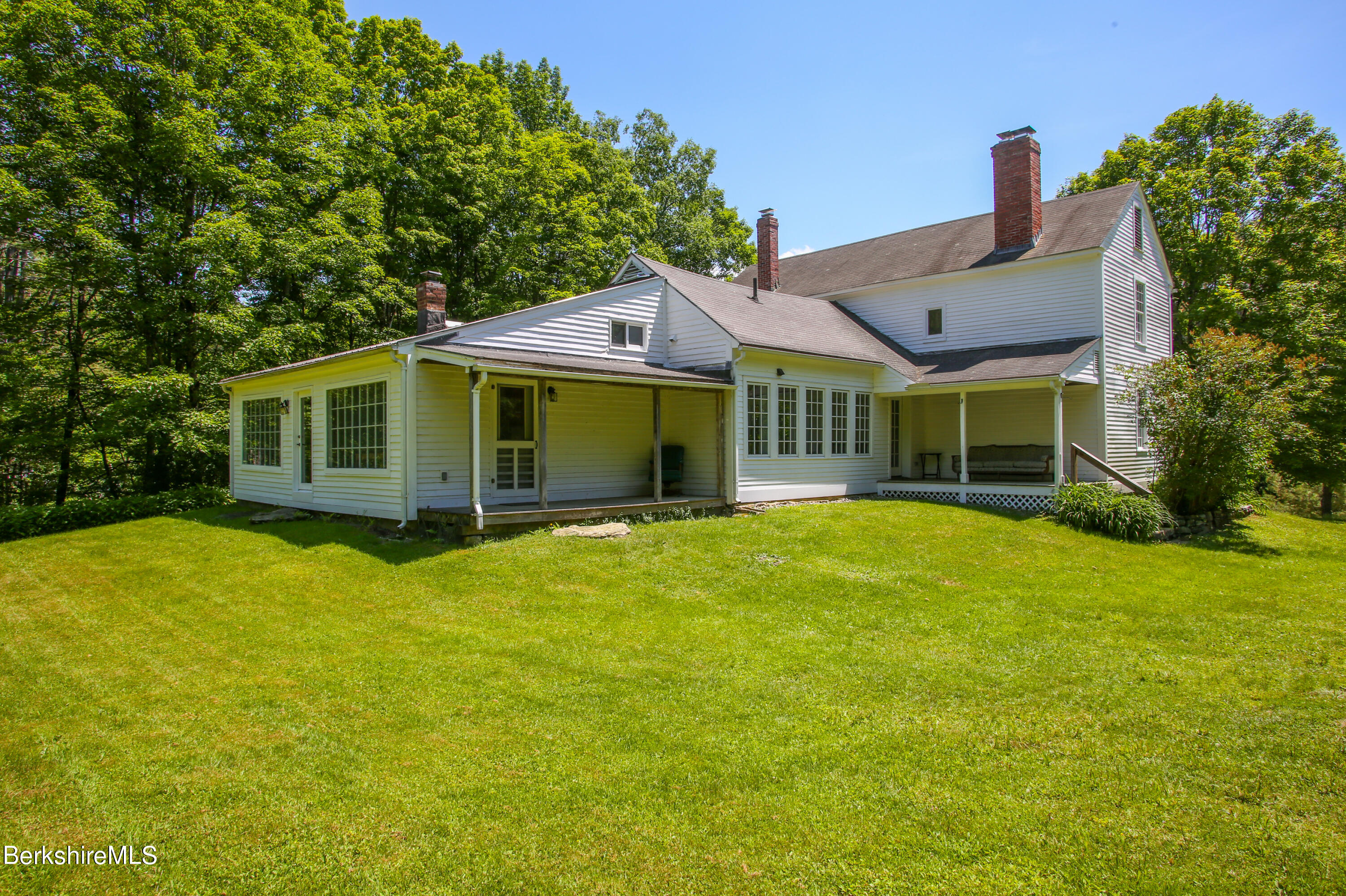 228 Zoar Road Rowe, MA 01367 - Photo 5 of 50 a front view of a house with a garden