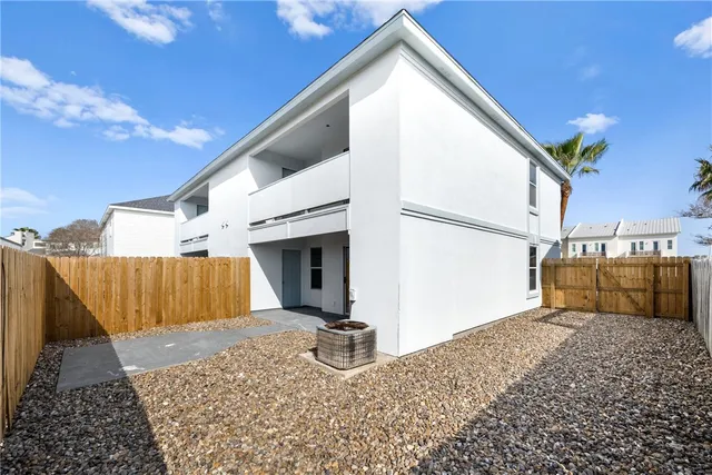 a view of a backyard of the house