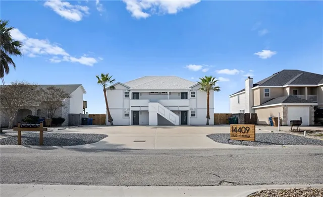 a view of a house with a street