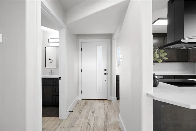 a view of a kitchen from the hallway