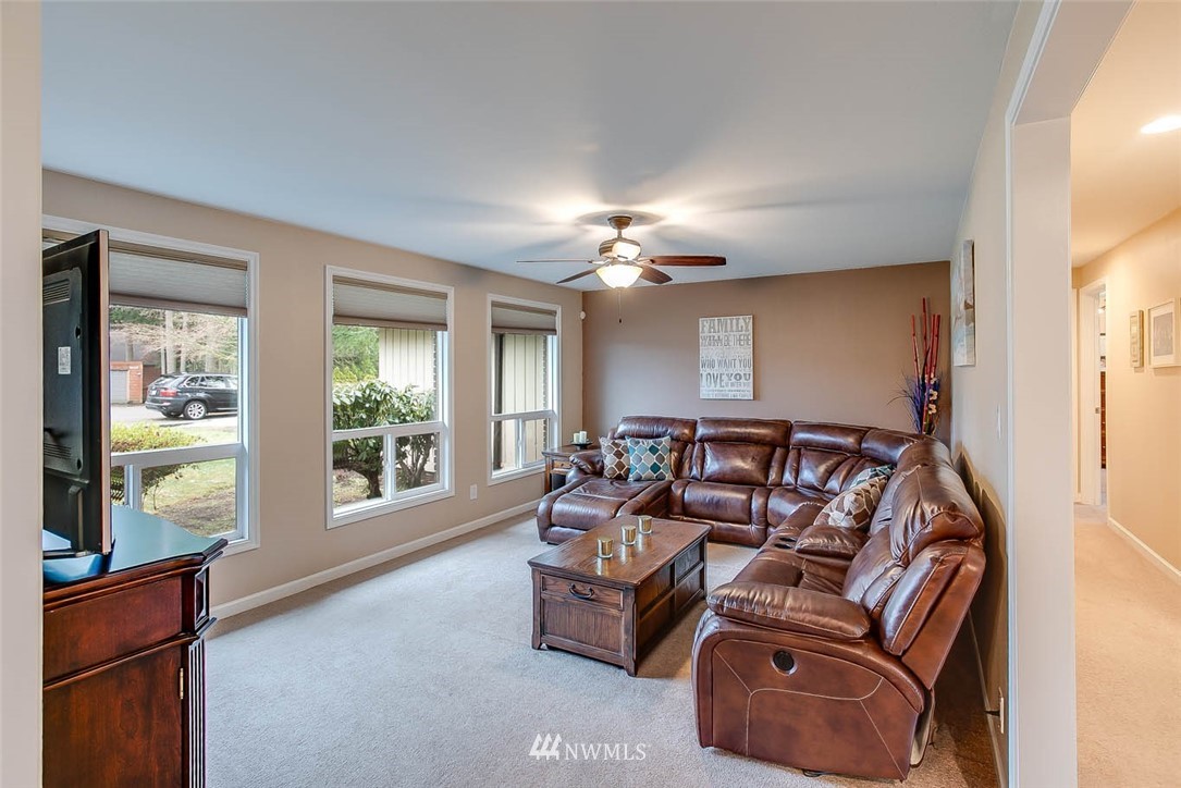 16120 Southeast 145th Place Renton, WA 98059 - Photo 2 of 22 a living room with furniture and a window