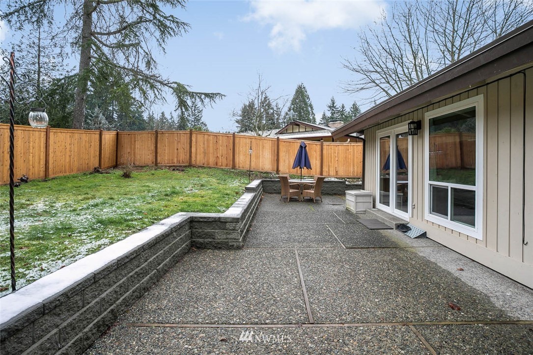 16120 Southeast 145th Place Renton, WA 98059 - Photo 20 of 22 a backyard of a house with table and chairs