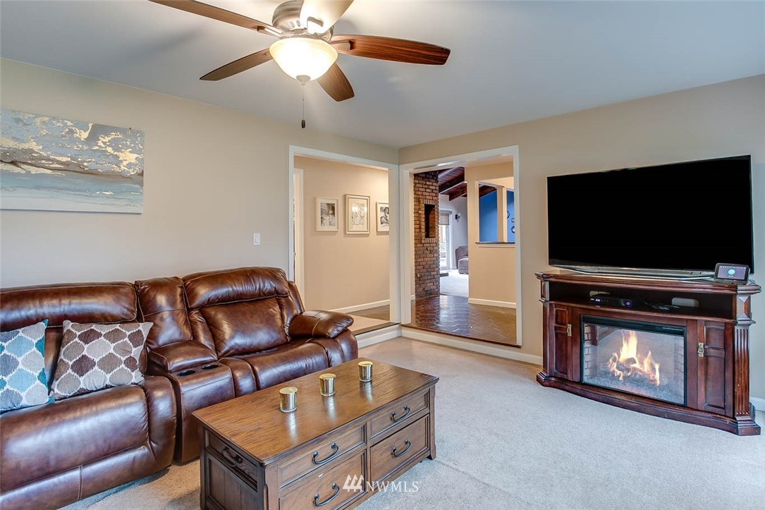 16120 Southeast 145th Place Renton, WA 98059 - Photo 3 of 22 a living room with furniture and a flat screen tv
