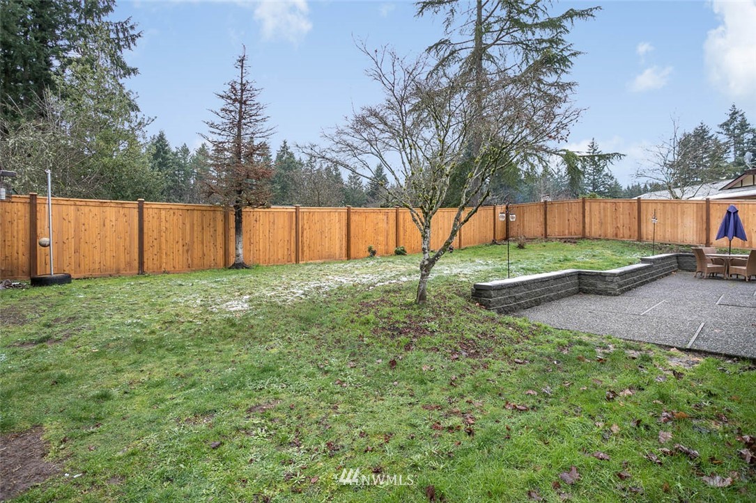 16120 Southeast 145th Place Renton, WA 98059 - Photo 21 of 22 a view of backyard with wooden fence