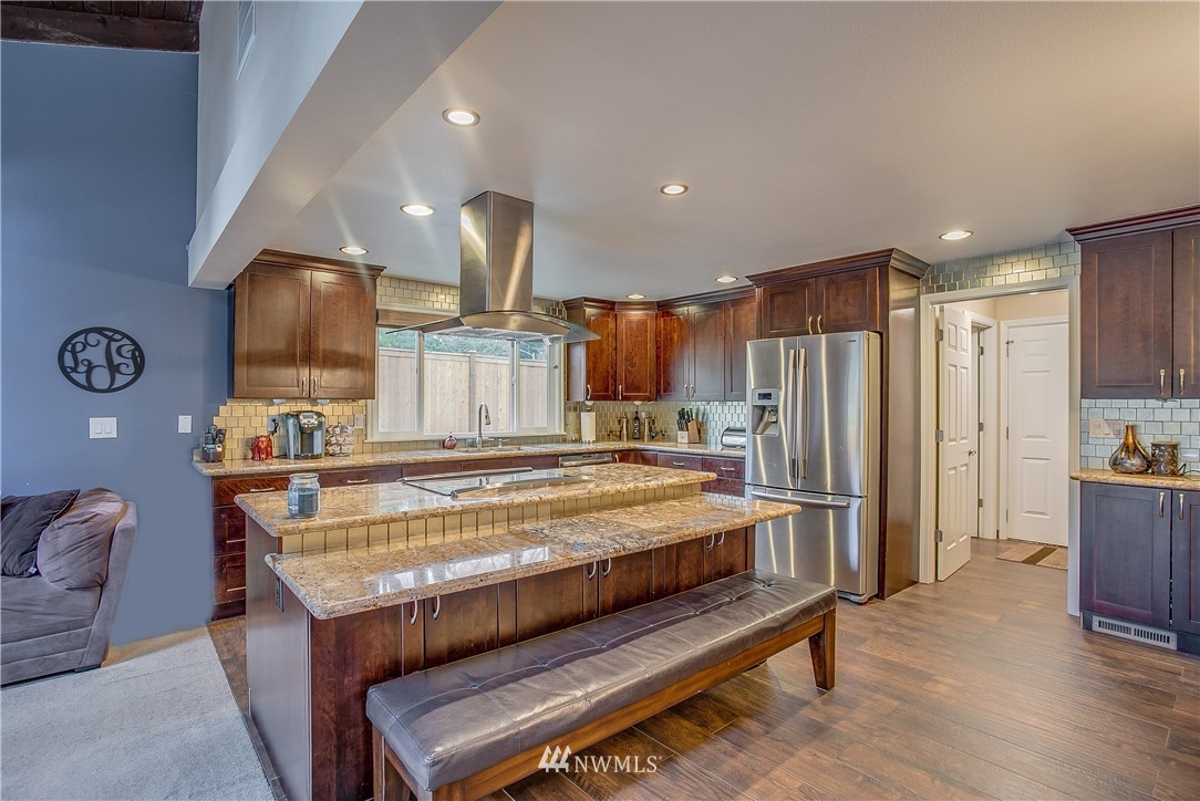 16120 Southeast 145th Place Renton, WA 98059 - Photo 8 of 22 a large kitchen with a table and chairs