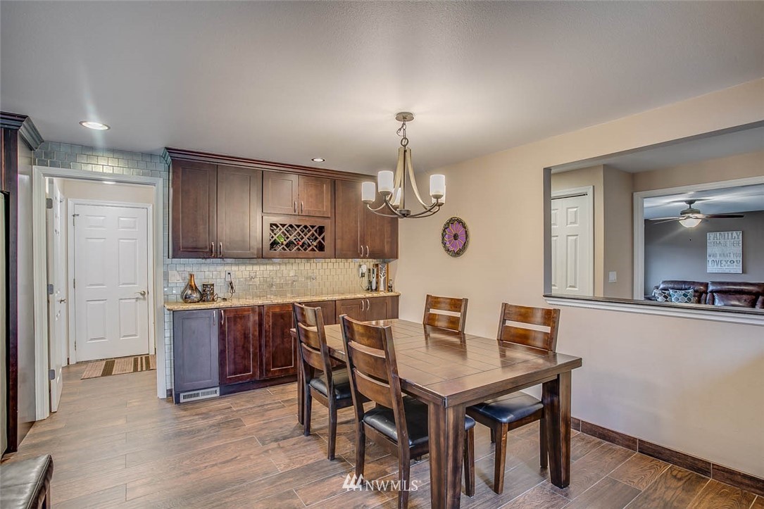 16120 Southeast 145th Place Renton, WA 98059 - Photo 9 of 22 a kitchen with a table and chairs in it