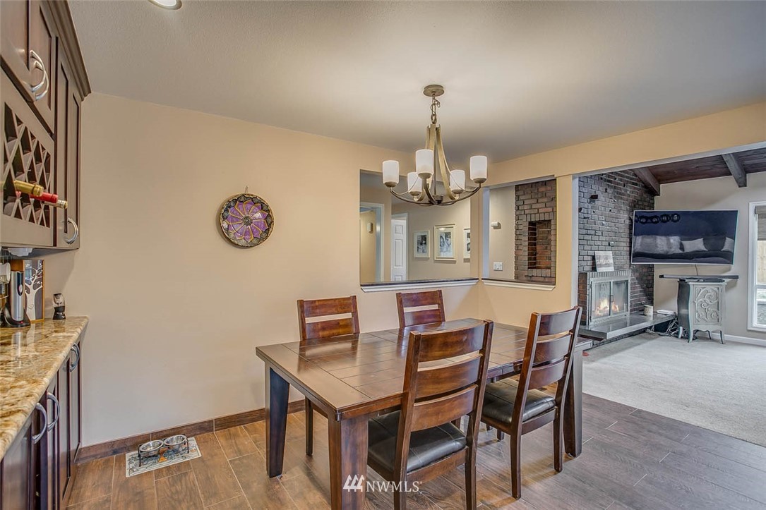 16120 Southeast 145th Place Renton, WA 98059 - Photo 10 of 22 a view of a dining room with furniture and chandelier