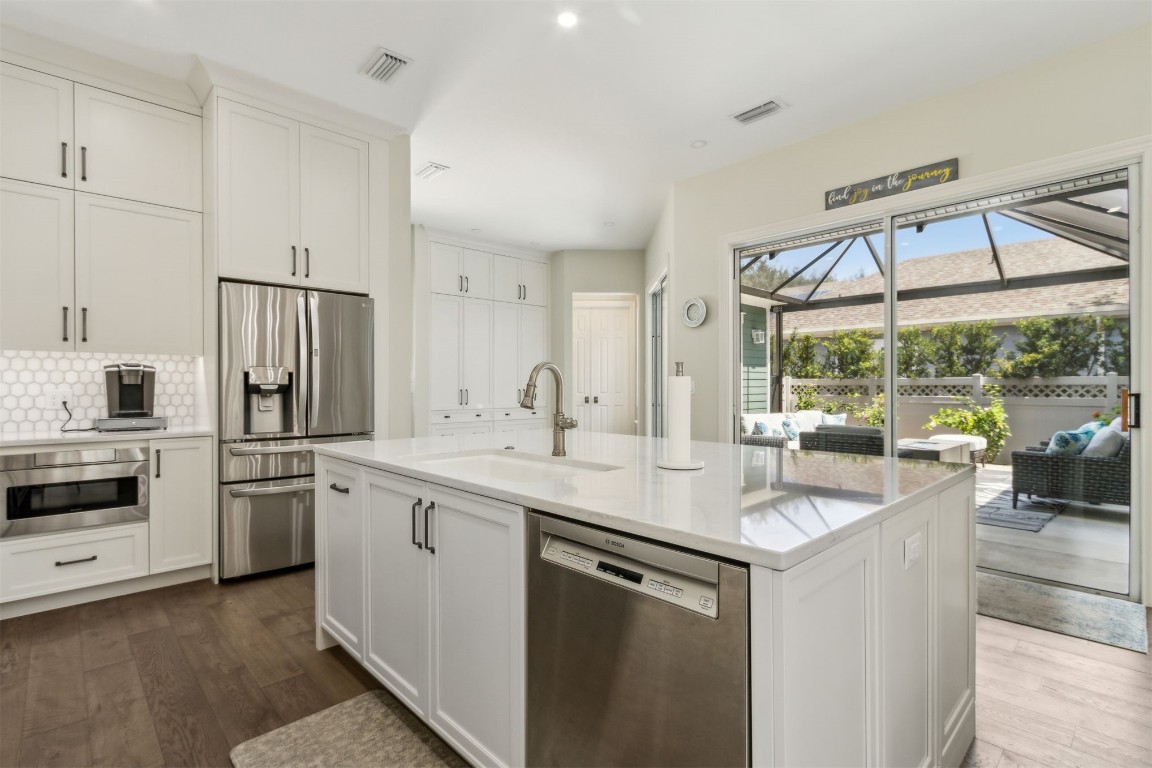 1775 Neighbor Street Fernandina Beach, FL 32034 - Photo 13 of 91 a kitchen with a sink stove and refrigerator