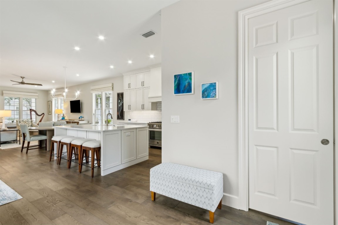 1775 Neighbor Street Fernandina Beach, FL 32034 - Photo 46 of 91 a large white dining hall with stainless steel appliances granite countertop a stove and a refrigerator