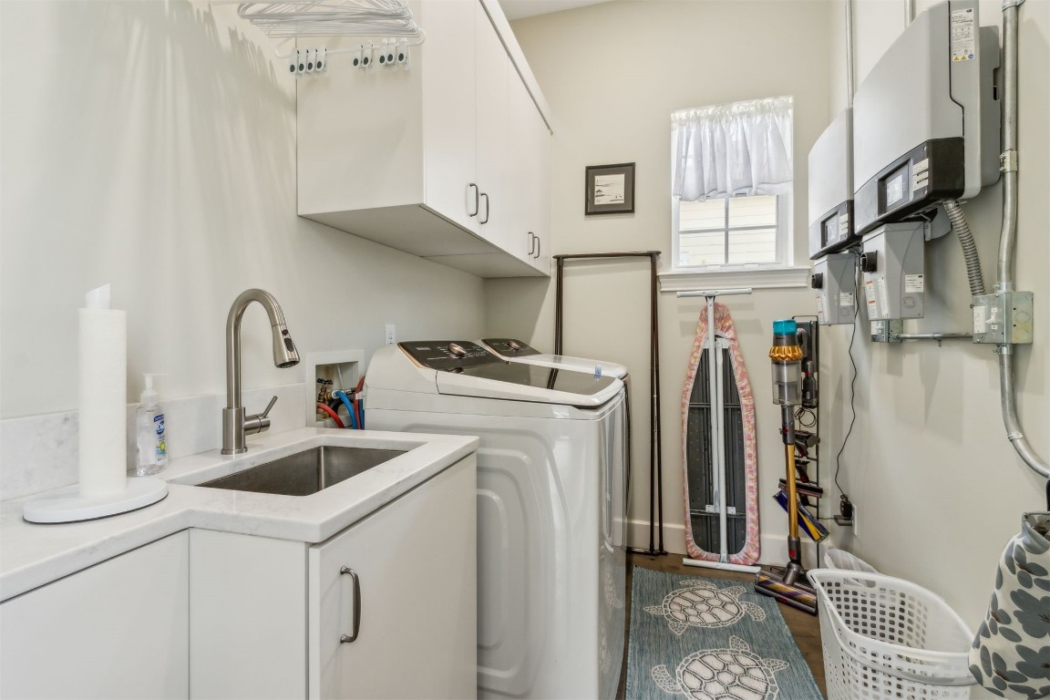 1775 Neighbor Street Fernandina Beach, FL 32034 - Photo 47 of 91 a kitchen with stainless steel appliances a sink a stove and a refrigerator