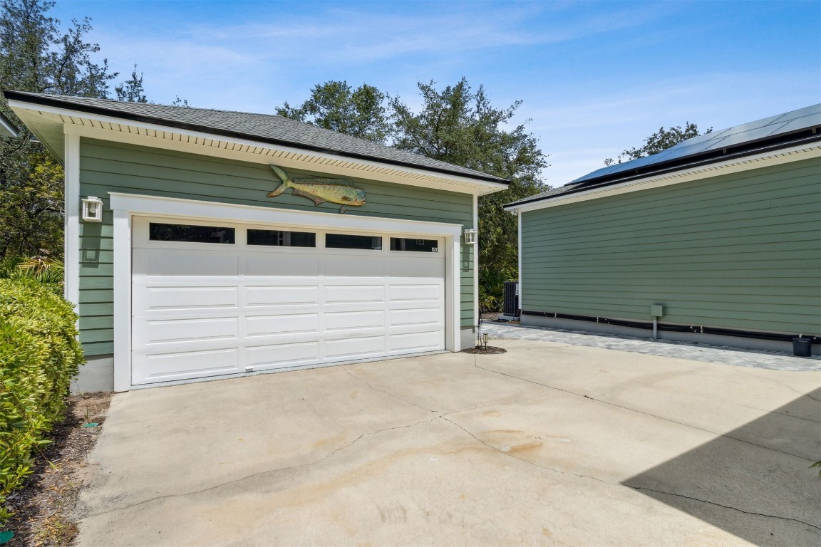 1775 Neighbor Street Fernandina Beach, FL 32034 - Photo 53 of 91 a front view of a house with a garage