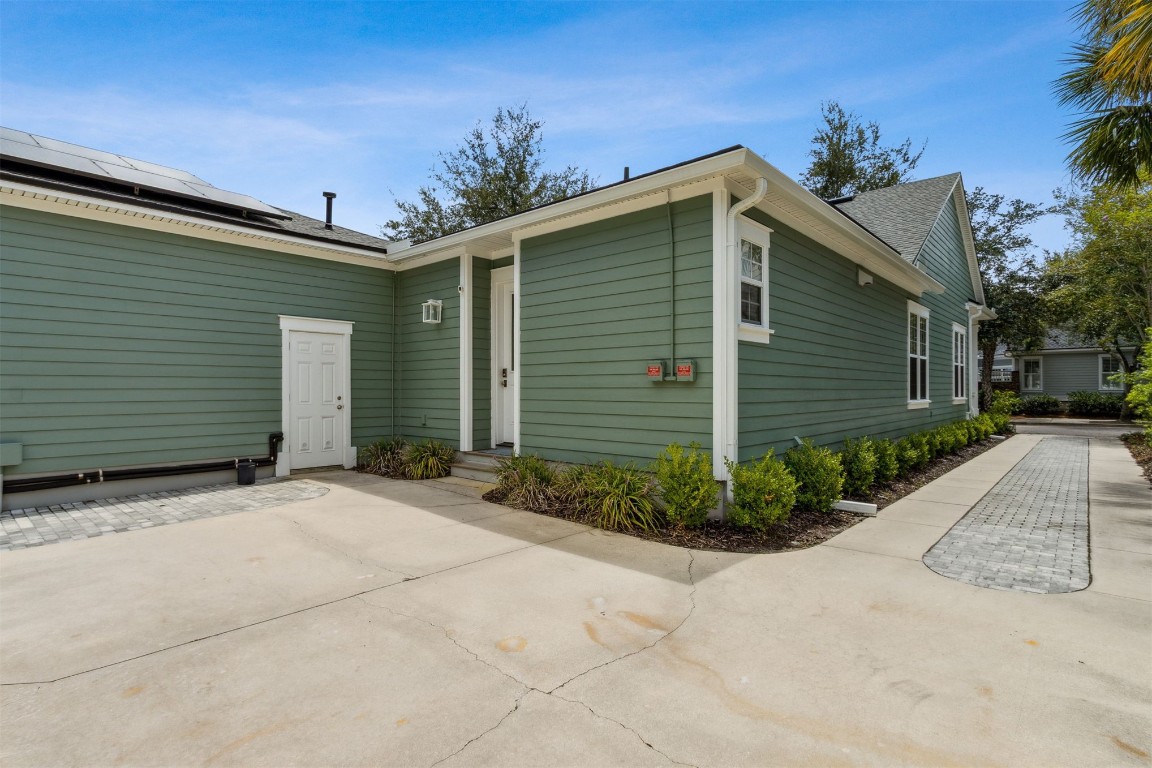1775 Neighbor Street Fernandina Beach, FL 32034 - Photo 54 of 91 a front view of a house with garden