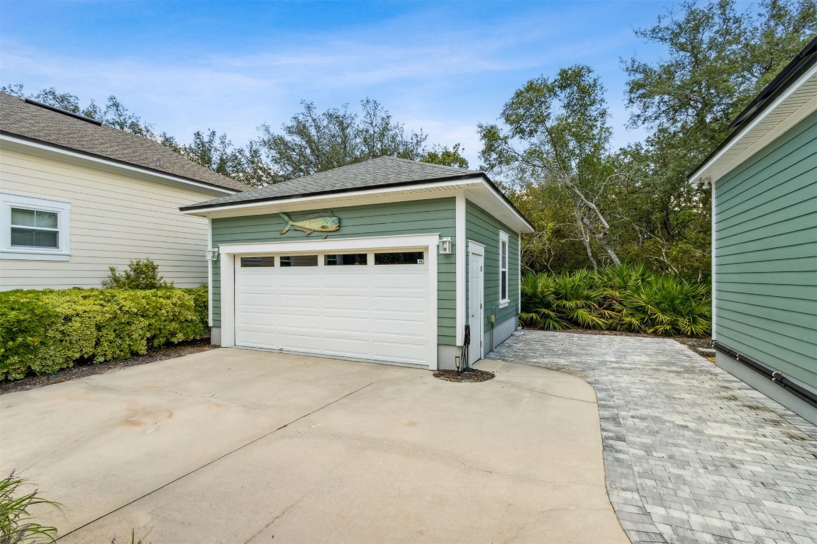 1775 Neighbor Street Fernandina Beach, FL 32034 - Photo 55 of 91 a view of backyard with potted plants and a large tree