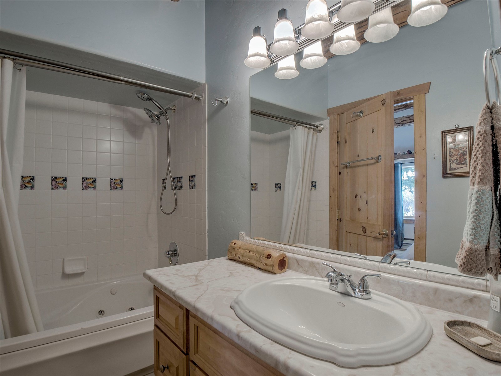46 Singleton Road Alma, CO 80420 - Photo 6 of 50 a bathroom with a sink a large mirror and shower