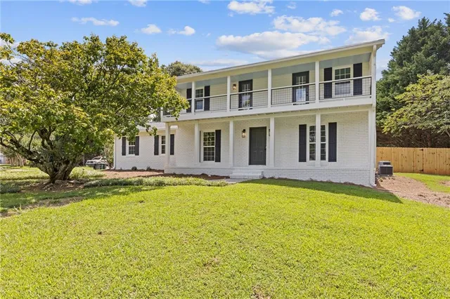 a swimming pool with the trees in the background