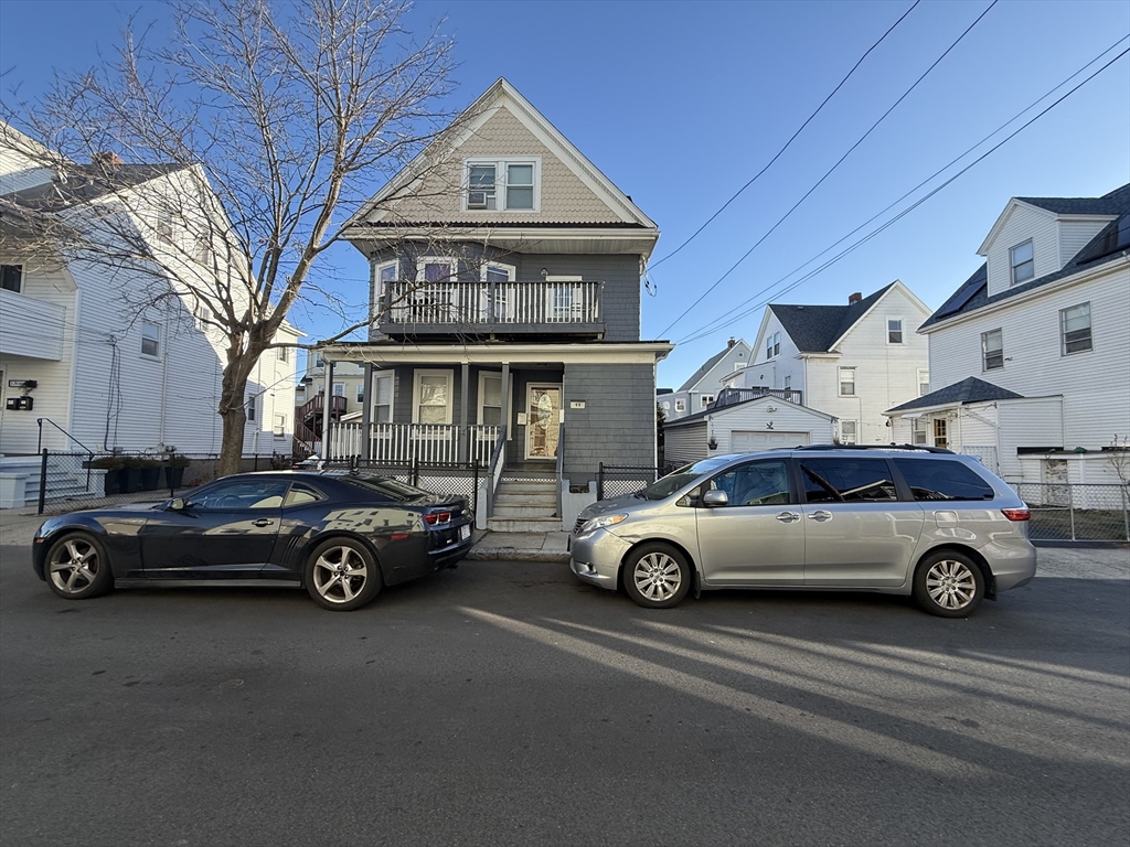 a car parked in front of a house