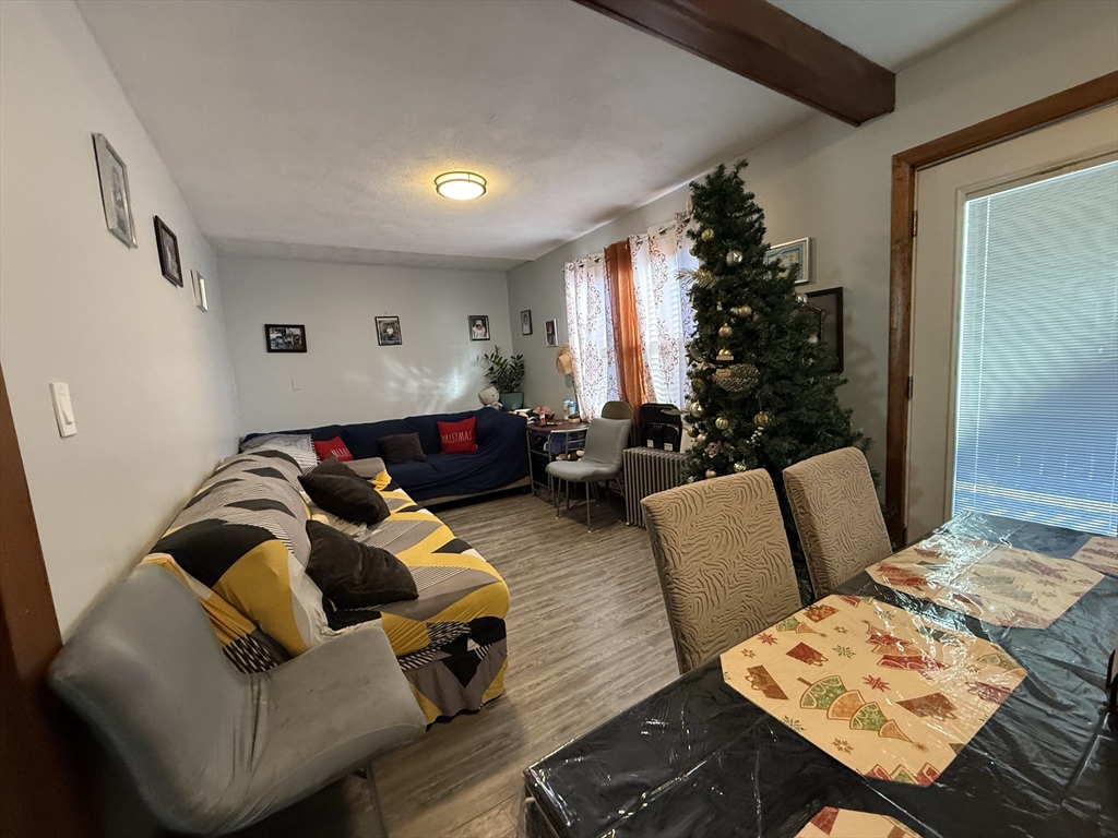 11 Forrest Street, Unit 2 Winthrop, MA 02152 - Photo 11 of 28 a living room with furniture and a table