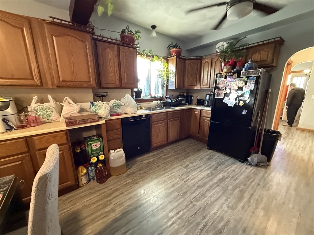 11 Forrest Street, Unit 2 Winthrop, MA 02152 - Photo 12 of 28 a kitchen with stainless steel appliances granite countertop a sink stove and cabinets