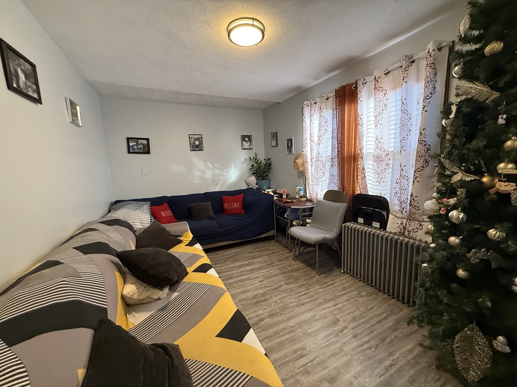 11 Forrest Street, Unit 2 Winthrop, MA 02152 - Photo 14 of 28 a living room with furniture and a window