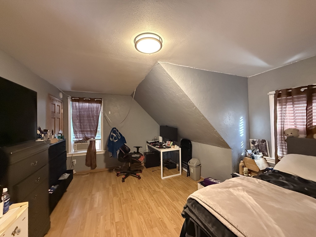 11 Forrest Street, Unit 2 Winthrop, MA 02152 - Photo 18 of 28 a bedroom with two beds and a flat screen tv