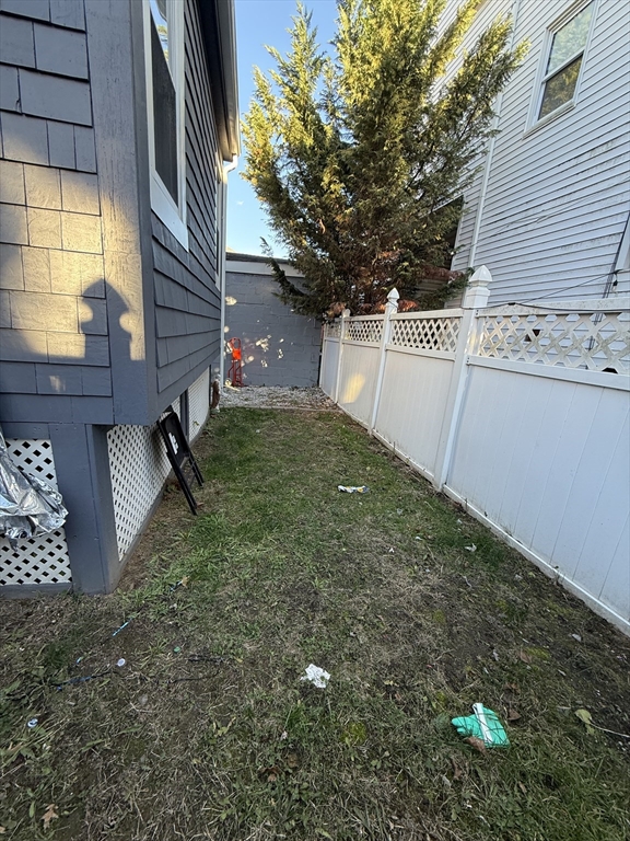11 Forrest Street, Unit 2 Winthrop, MA 02152 - Photo 27 of 28 a backyard of a house with lots of green space