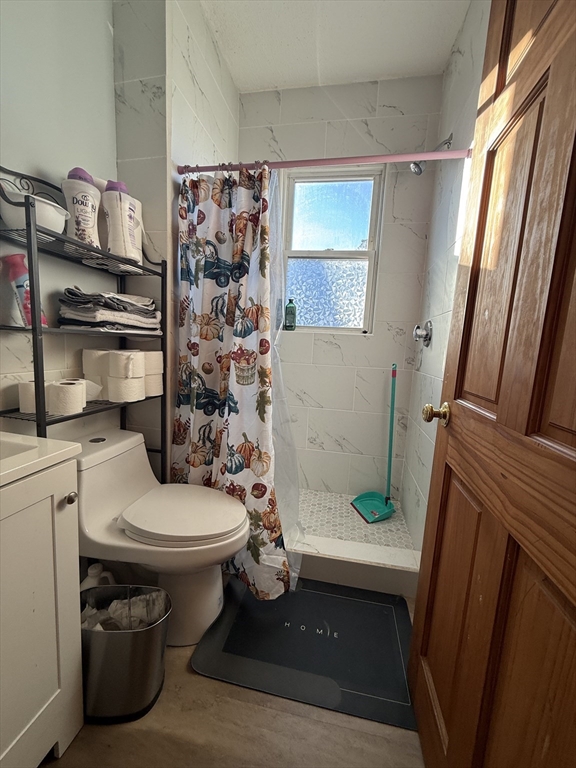 11 Forrest Street, Unit 2 Winthrop, MA 02152 - Photo 7 of 28 a bathroom with a sink toilet and shower