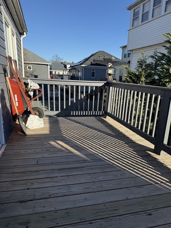 11 Forrest Street, Unit 2 Winthrop, MA 02152 - Photo 9 of 28 a view of a wooden deck with a barbeque
