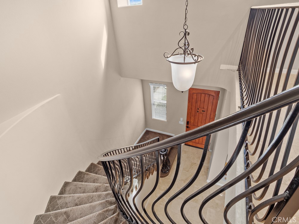 568 Vía Pueblo Riverside, CA 92507 - Photo 25 of 46 Grand staircase accented with ornate wrought-iron railings