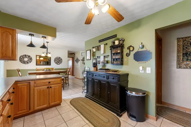 a kitchen with stainless steel appliances granite countertop a stove and cabinets