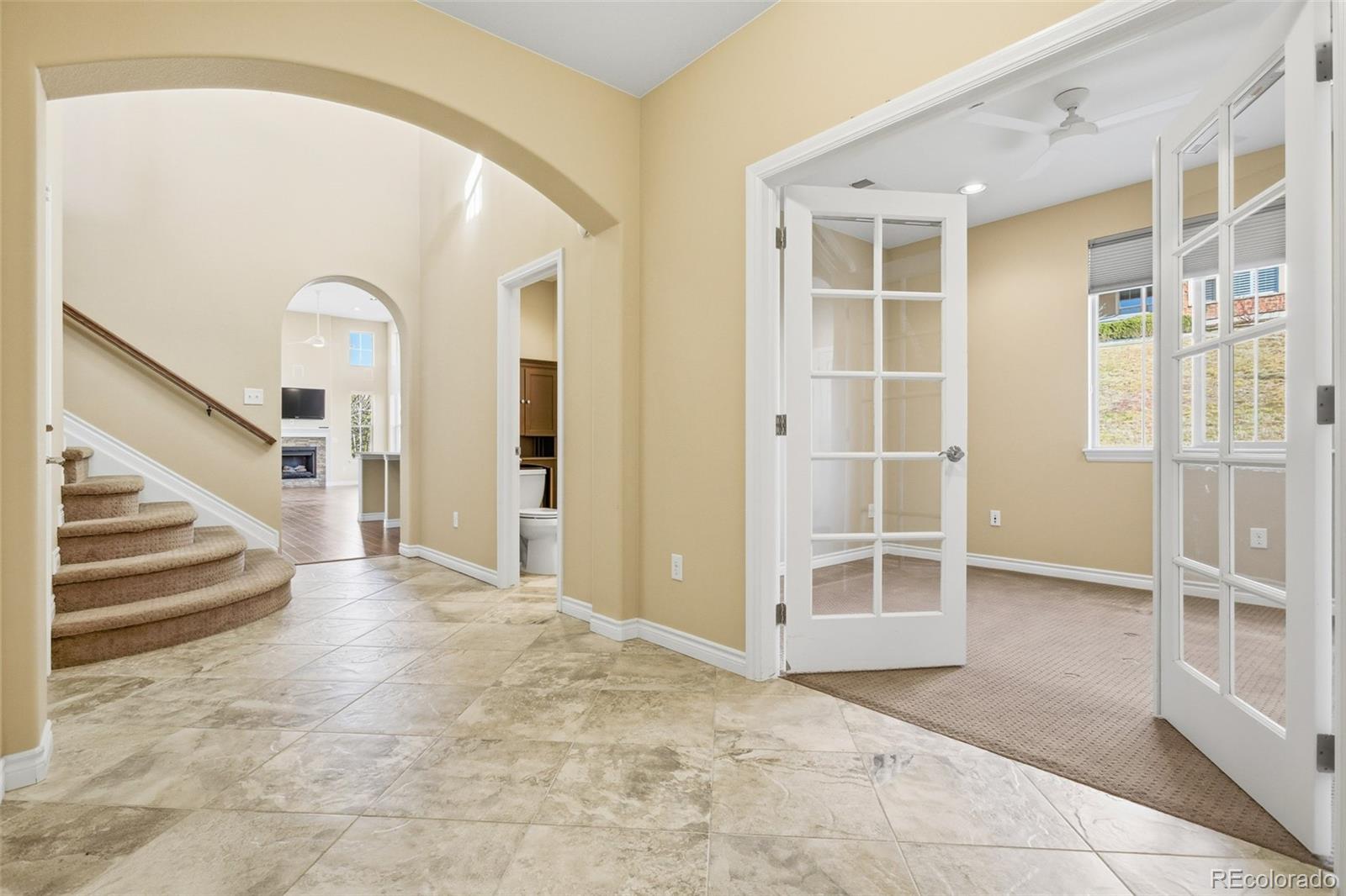 9470 Sori Lane Highlands Ranch, CO 80126 - Photo 18 of 32 a view of a hallway with wooden floor and entryway