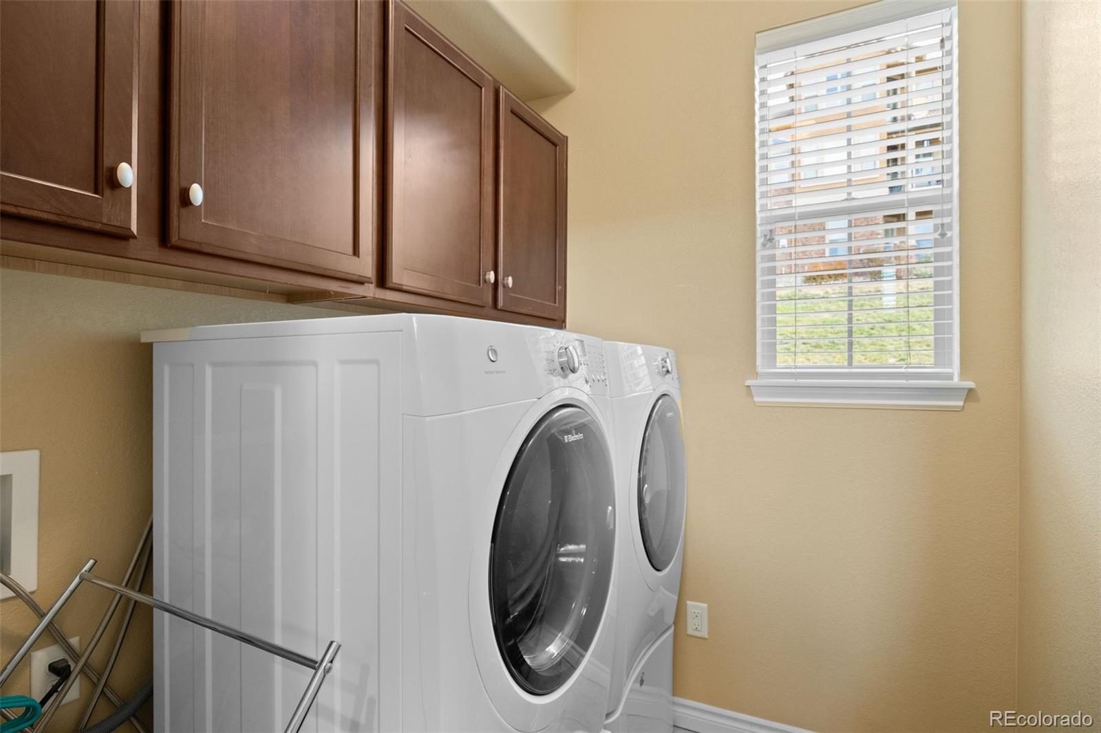 9470 Sori Lane Highlands Ranch, CO 80126 - Photo 21 of 32 a utility room with dryer and washer