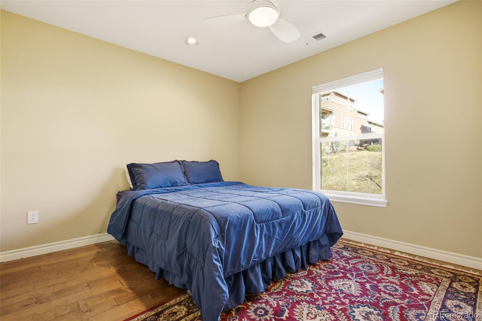 9470 Sori Lane Highlands Ranch, CO 80126 - Photo 25 of 32 a bedroom with a bed and a window