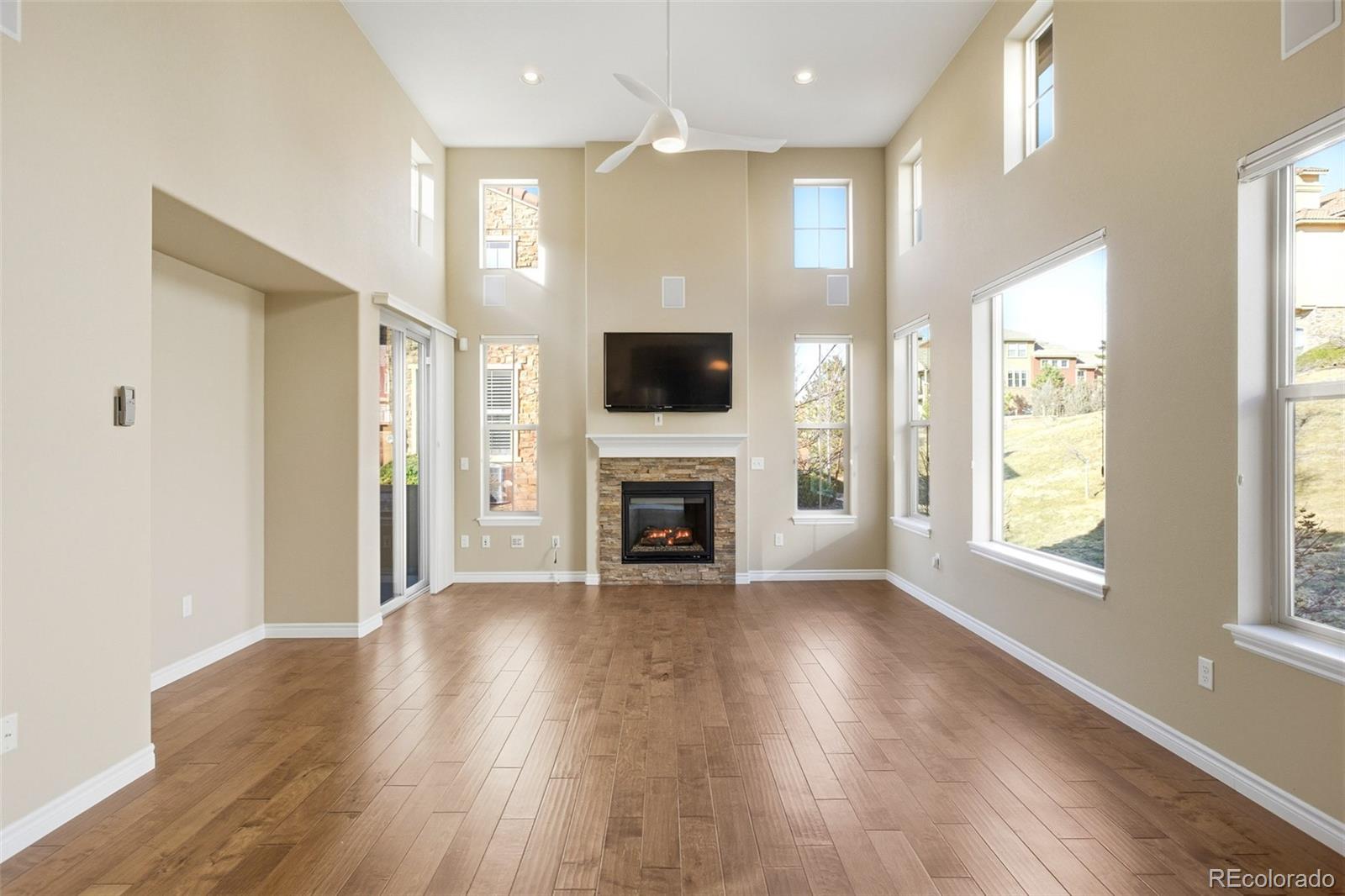 9470 Sori Lane Highlands Ranch, CO 80126 - Photo 5 of 32 a view of an empty room with wooden floor and a window