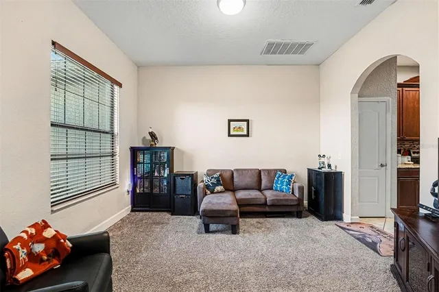 a living room with furniture and a window