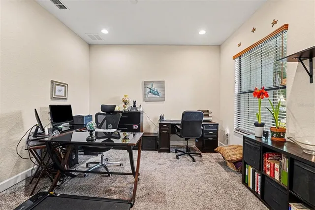 a view of a workspace with furniture