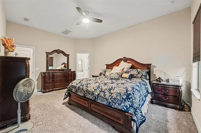 a bedroom with a bed and a tv in it