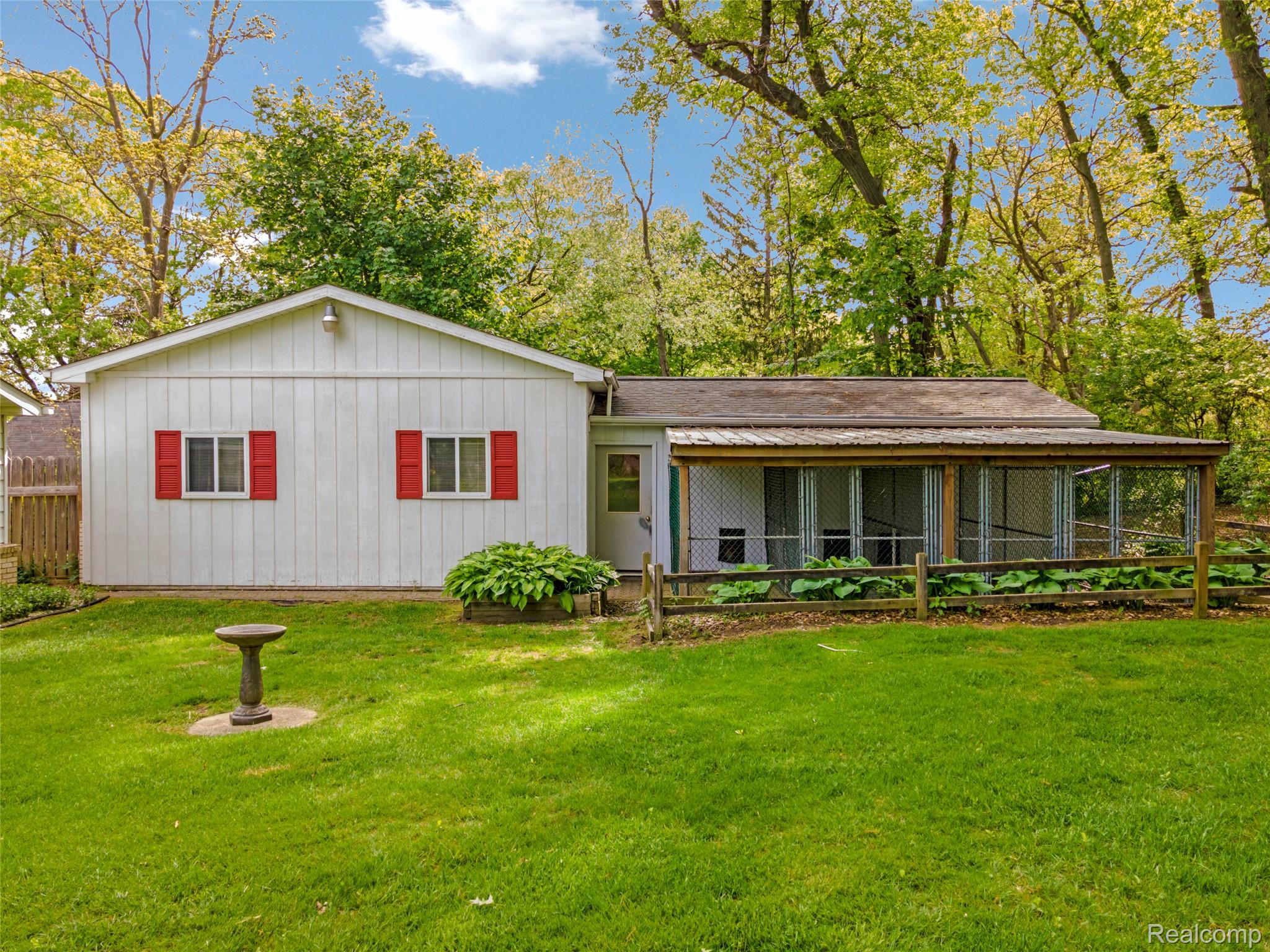 8887 Clark Road Clarkston, MI 48346 - Photo 30 of 40 Back of house with a yard